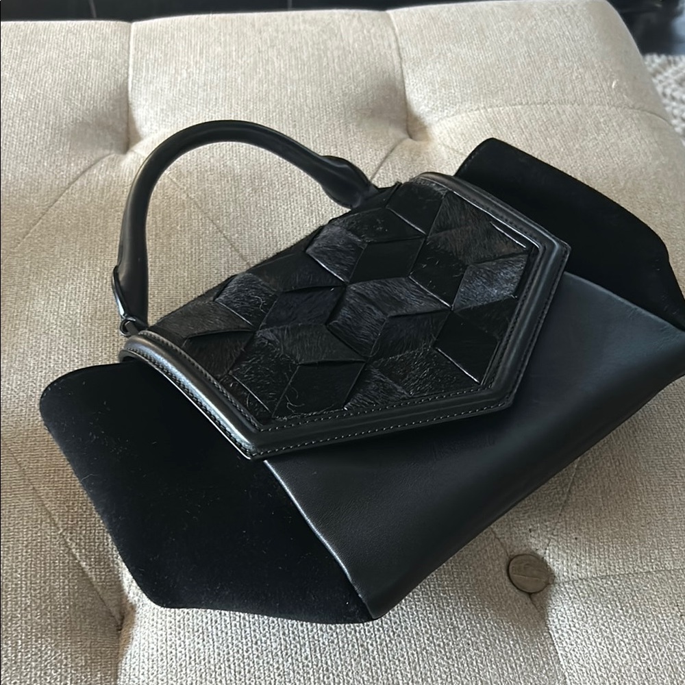 Welden handbag. New . Weathered cowhide and leather.
Classy.